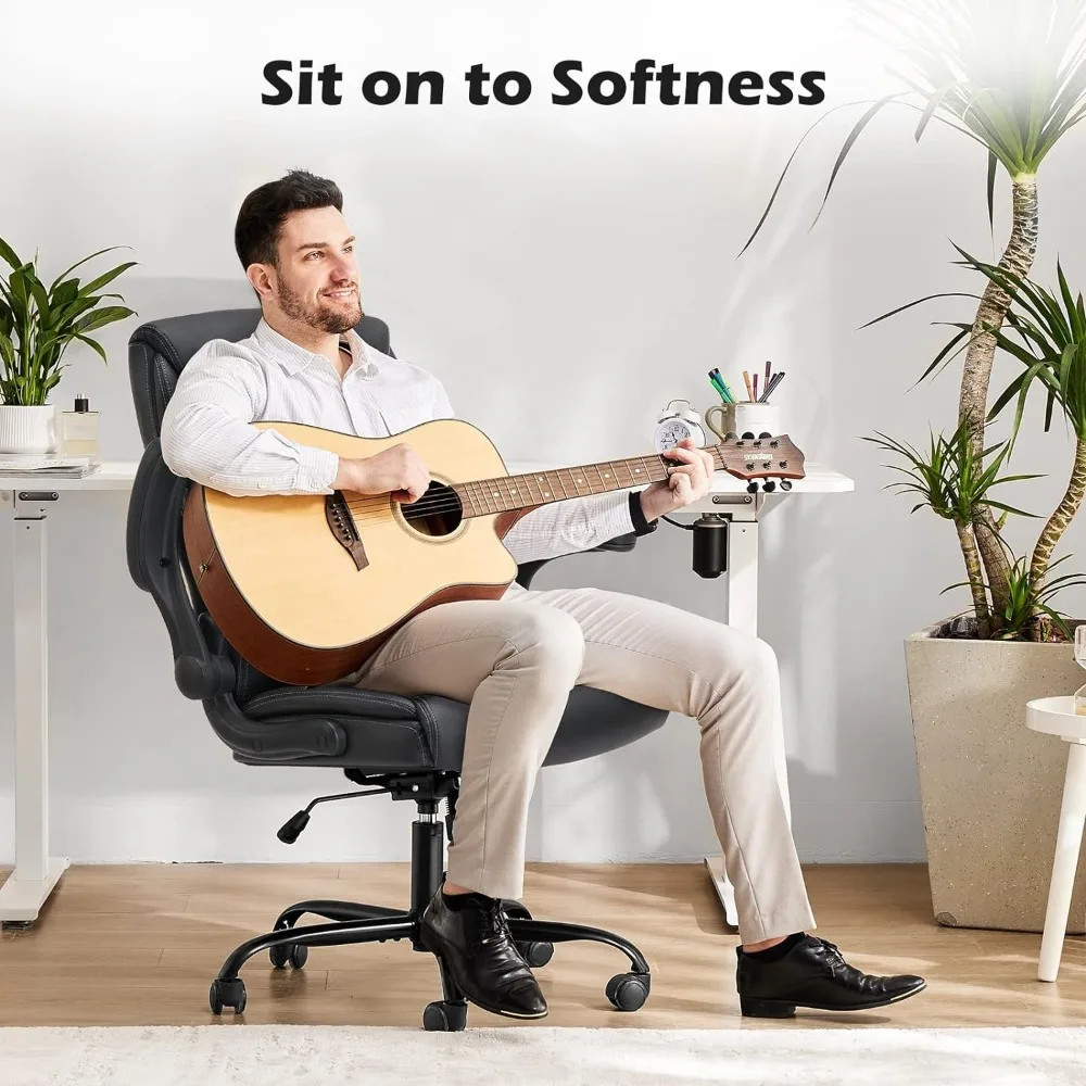 Person sitting in chair while playing guitar